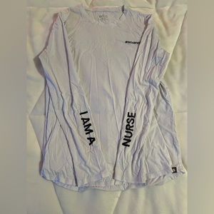 White FIGS I AM A NURSE small underscrub long sleeve shirt.